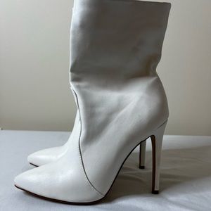 White 4 inch heel boots.